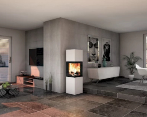 Der neocube Style Kaminofen steht in einem modernen Wohnzimmer an der Ecke einer eingezogenen Wand.